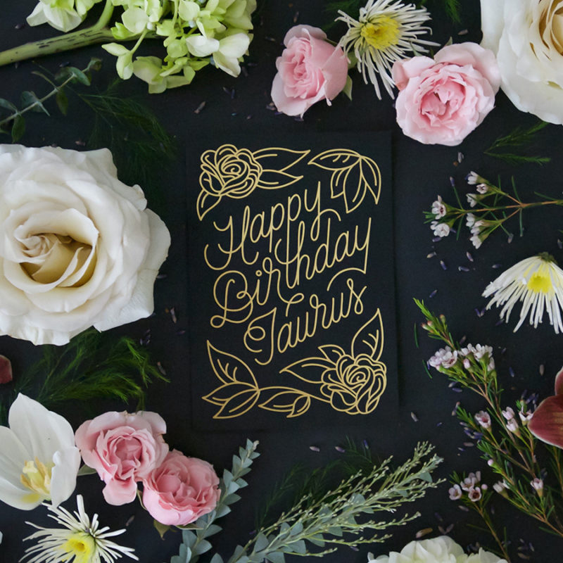 Black screen printed & foil stamped Zodiac Flora birthday card, which reads 