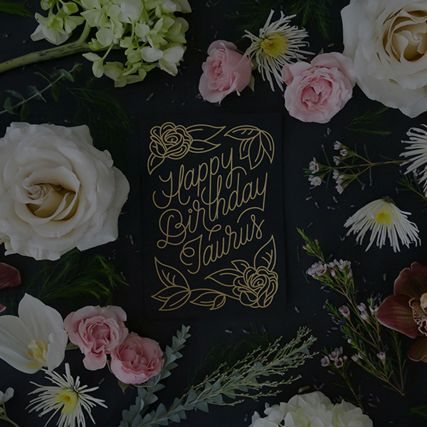 Black screen printed & foil stamped Zodiac Flora birthday card, which reads "Happy Birthday Taurus". Designed by Gather & Seek (formerly Chelley Co.) in collaboration with Melissa Deckert.