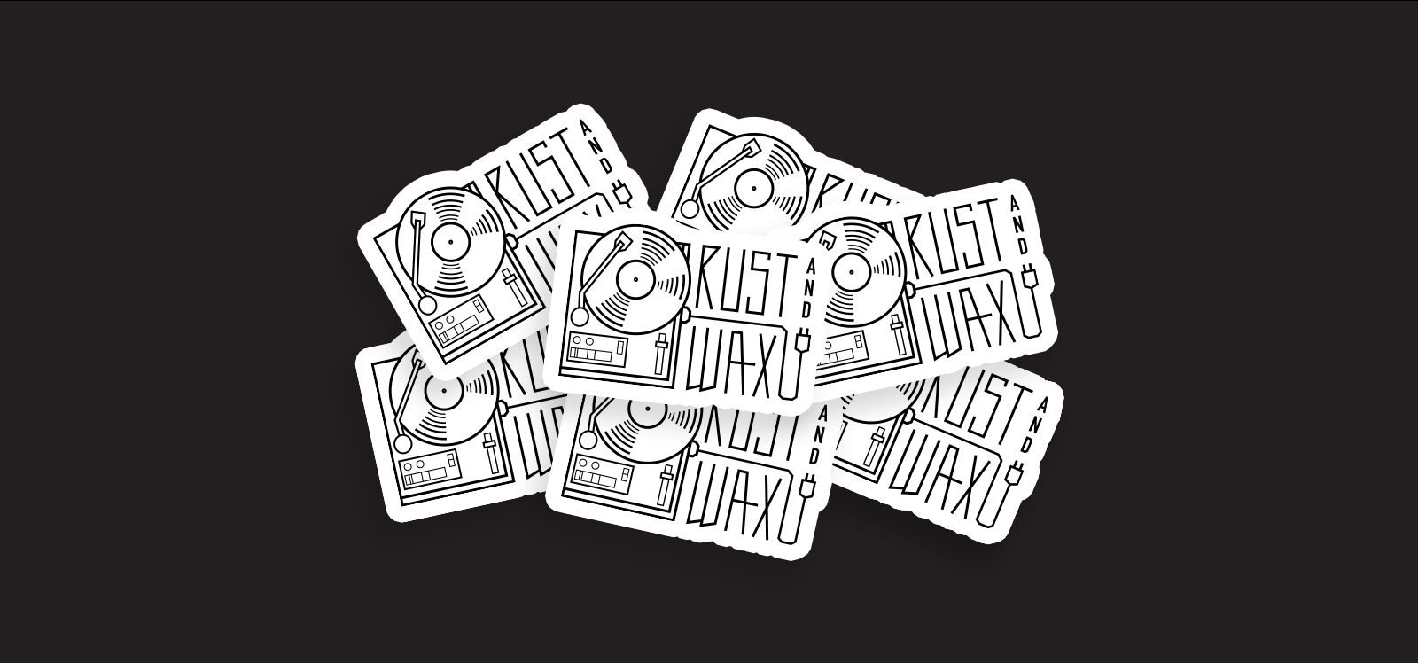 Black & white sticker mockups of a minimal linework illustrated record player and "Rust & Wax" in a custom lettering.