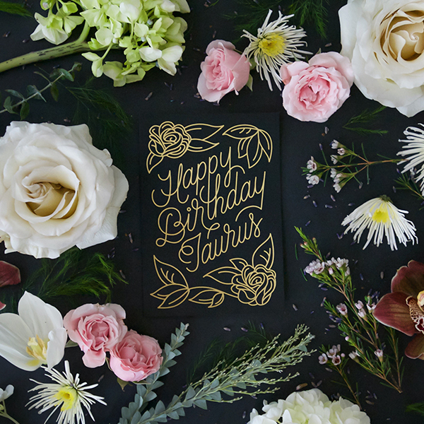 Black screen printed & foil stamped Zodiac Flora birthday card, which reads 