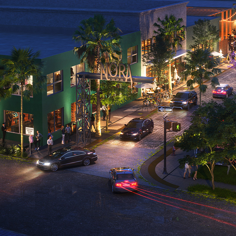 Rendering of NORA development in West Palm Beach showing a night city scape including cars driving on the road, palm trees, warehouses, and signage above the main road which reads "NORA".